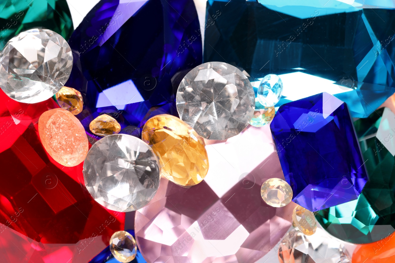 Photo of Different beautiful gemstones for jewelry as background, flat lay
