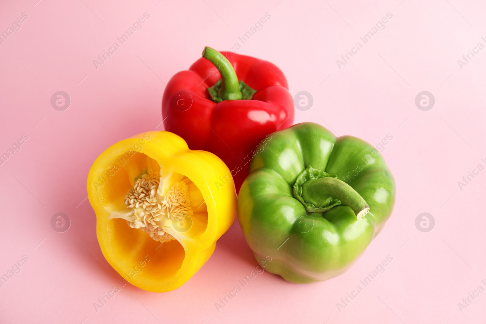 Photo of Raw ripe paprika peppers on color background