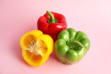 Photo of Raw ripe paprika peppers on color background