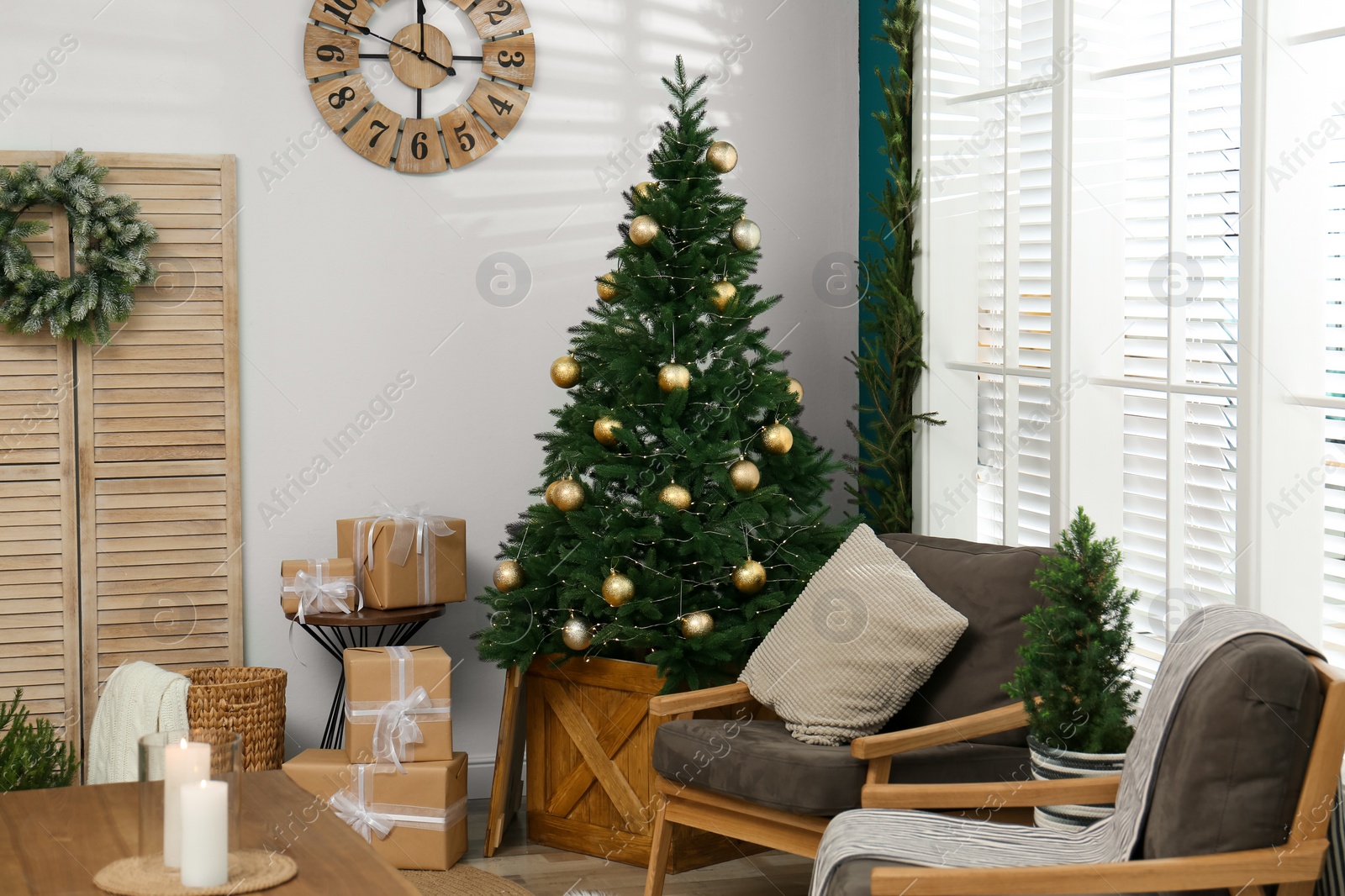 Photo of Beautiful decorated Christmas tree in living room interior