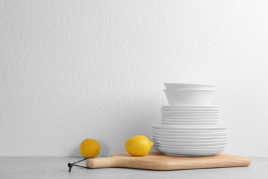 Photo of Set of dishware on table against white background