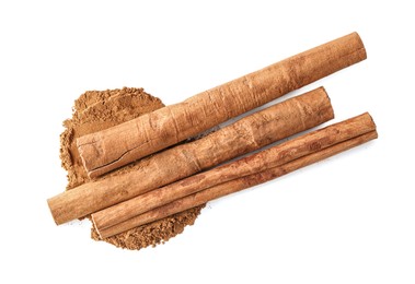 Photo of Dry aromatic cinnamon sticks and powder isolated on white, top view