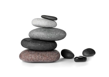 Stack of spa stones on white background