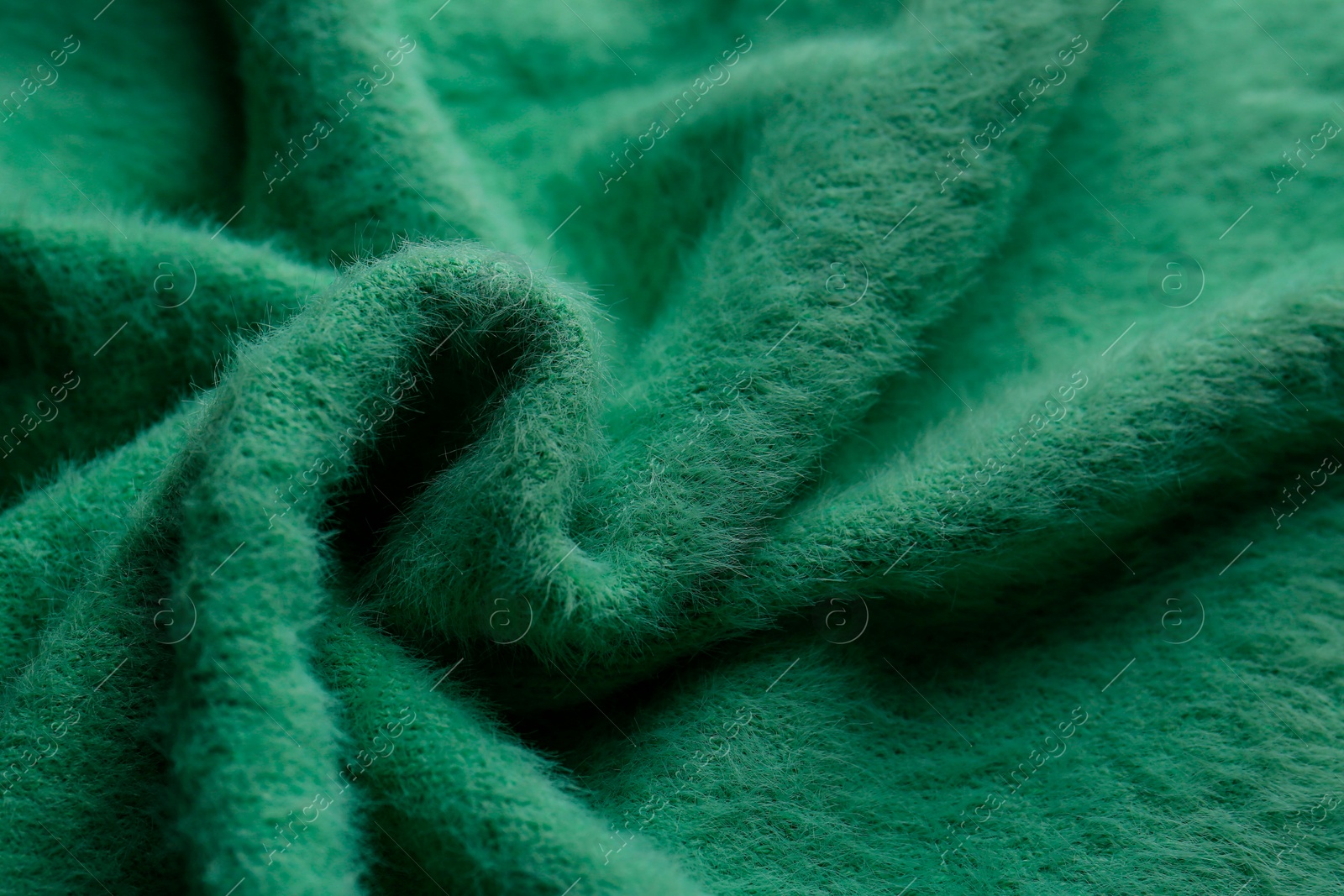 Photo of Beautiful green fabric as background, closeup view