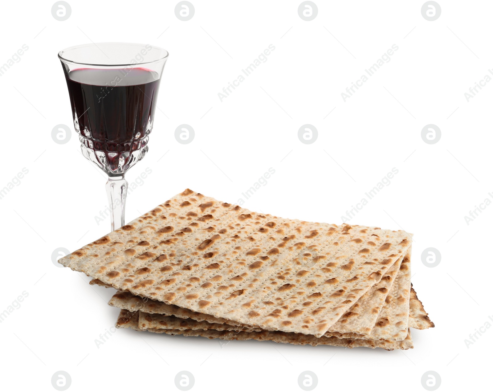 Photo of Traditional matzos and red wine on white background