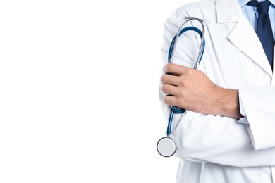 Male doctor holding stethoscope on white background, closeup with space for text