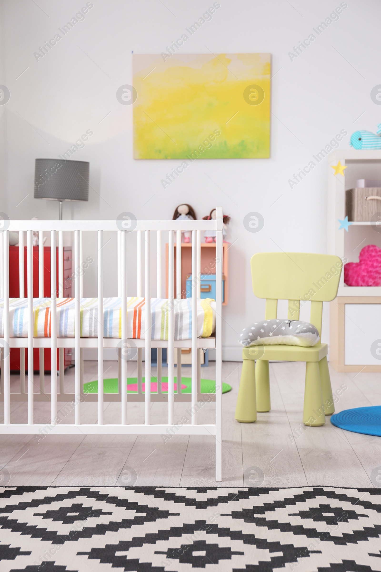 Photo of Baby room interior with comfortable crib