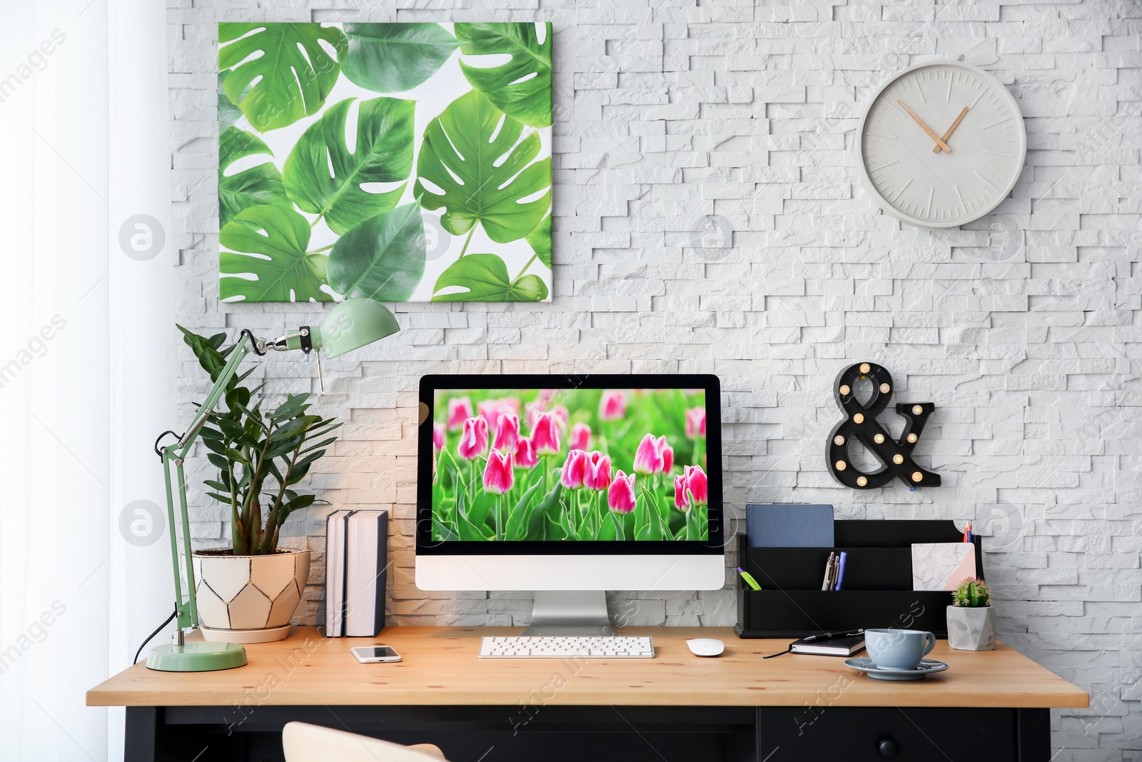 Photo of Stylish workplace with computer on table