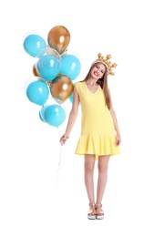 Young woman with crown and air balloons on white background