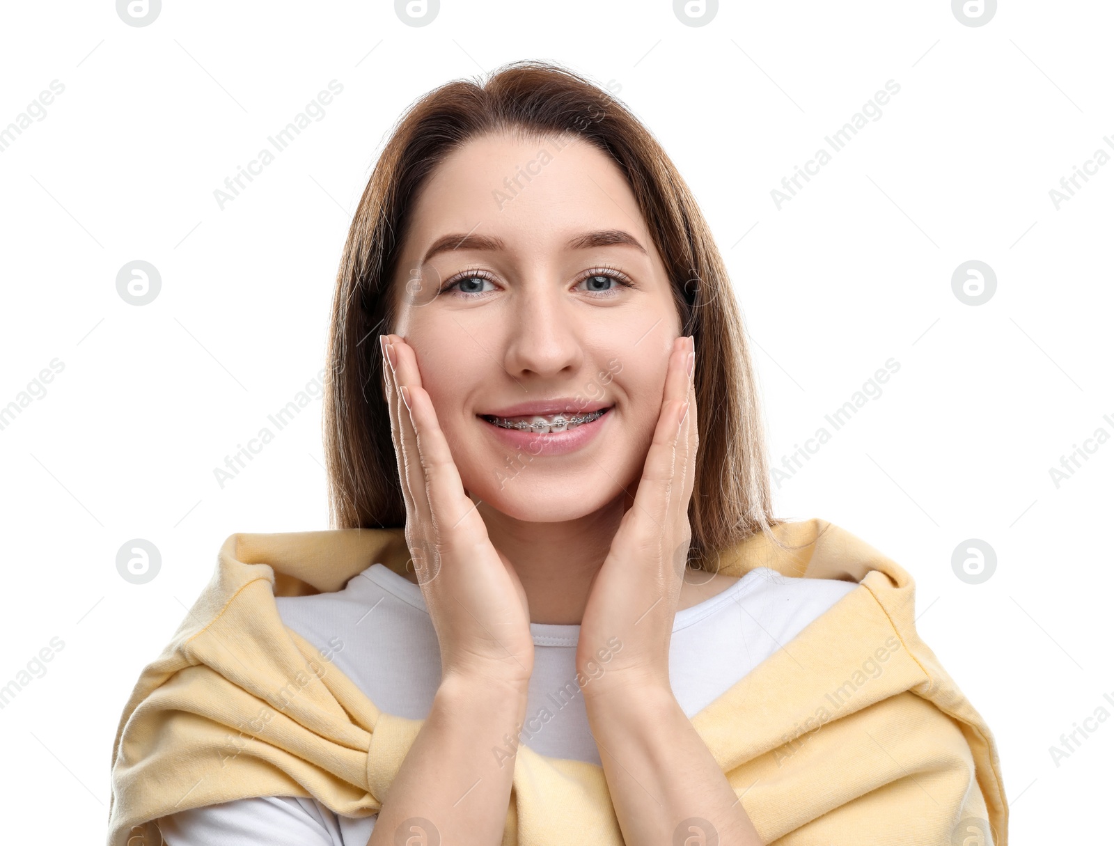 Photo of Portrait of smiling woman with dental braces on white background