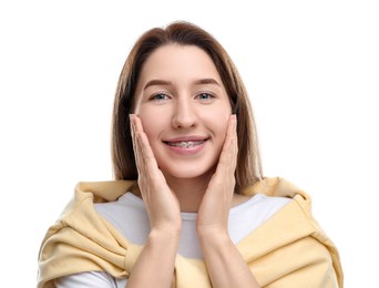 Portrait of smiling woman with dental braces on white background