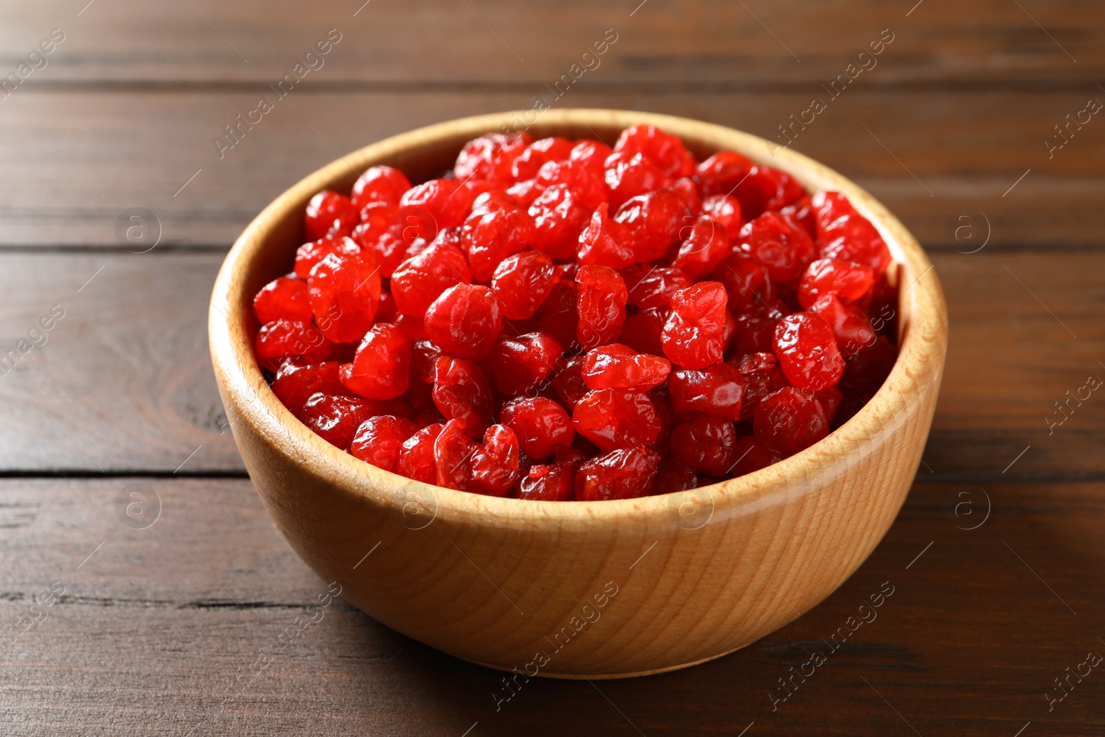 Photo of Bowl of sweet cherries on table, closeup. Dried fruit as healthy snack