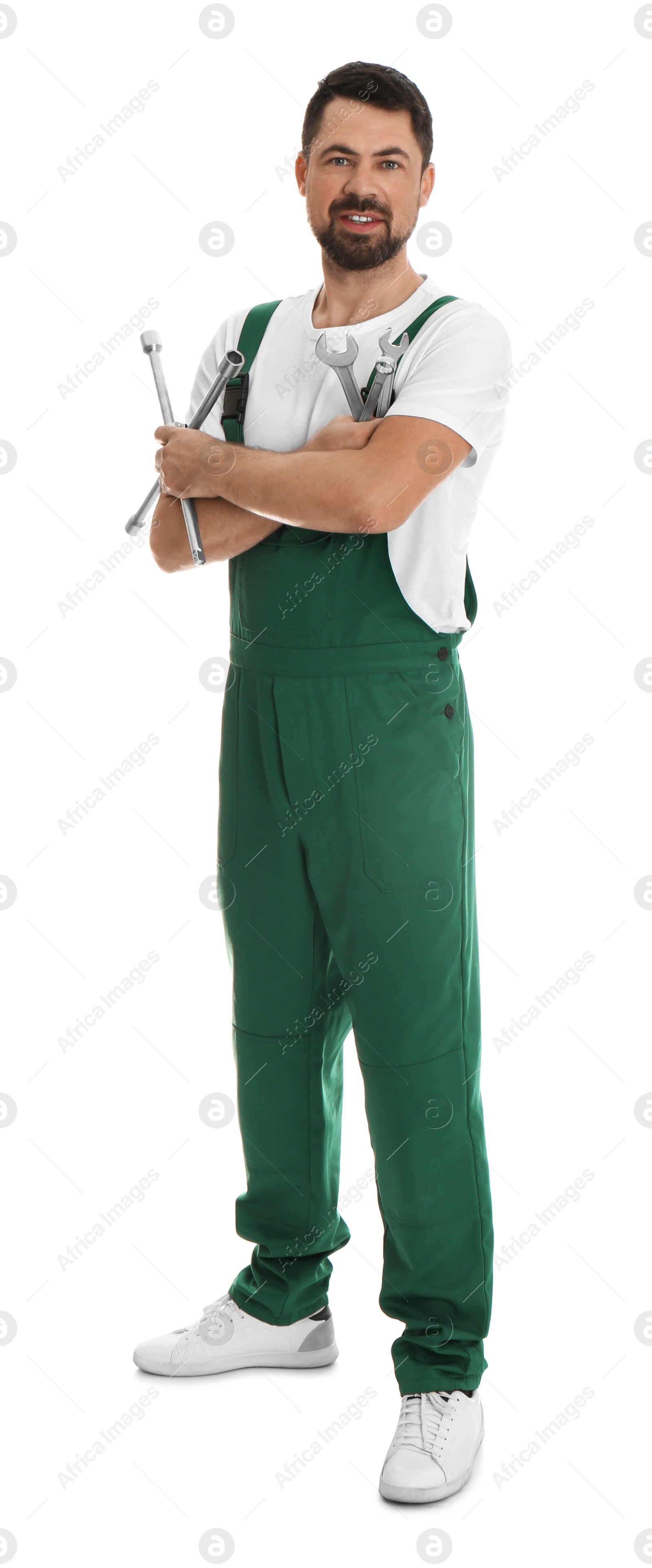 Photo of Full length portrait of professional auto mechanic with wrenches on white background