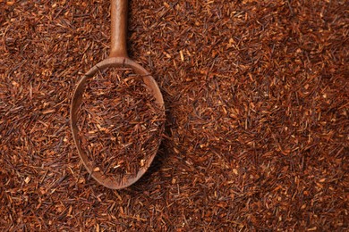 Rooibos tea and wooden spoon, top view