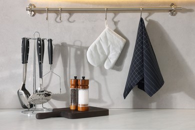 Photo of Set of different utensils on countertop in kitchen