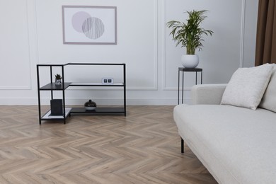 Modern living room with parquet flooring and stylish furniture