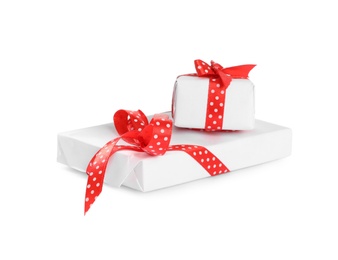 Christmas gift boxes decorated with red bows on white background