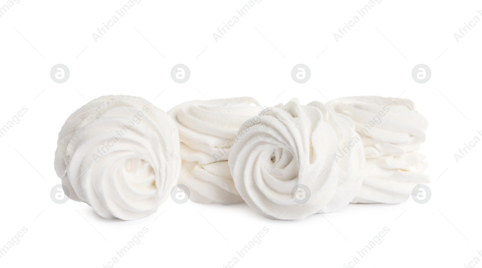 Photo of Many delicious sweet zephyrs on white background