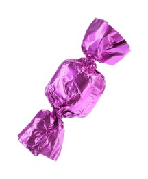 Photo of Tasty candy in violet wrapper isolated on white