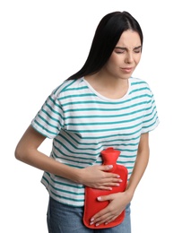 Woman using hot water bottle to relieve menstrual pain on white background
