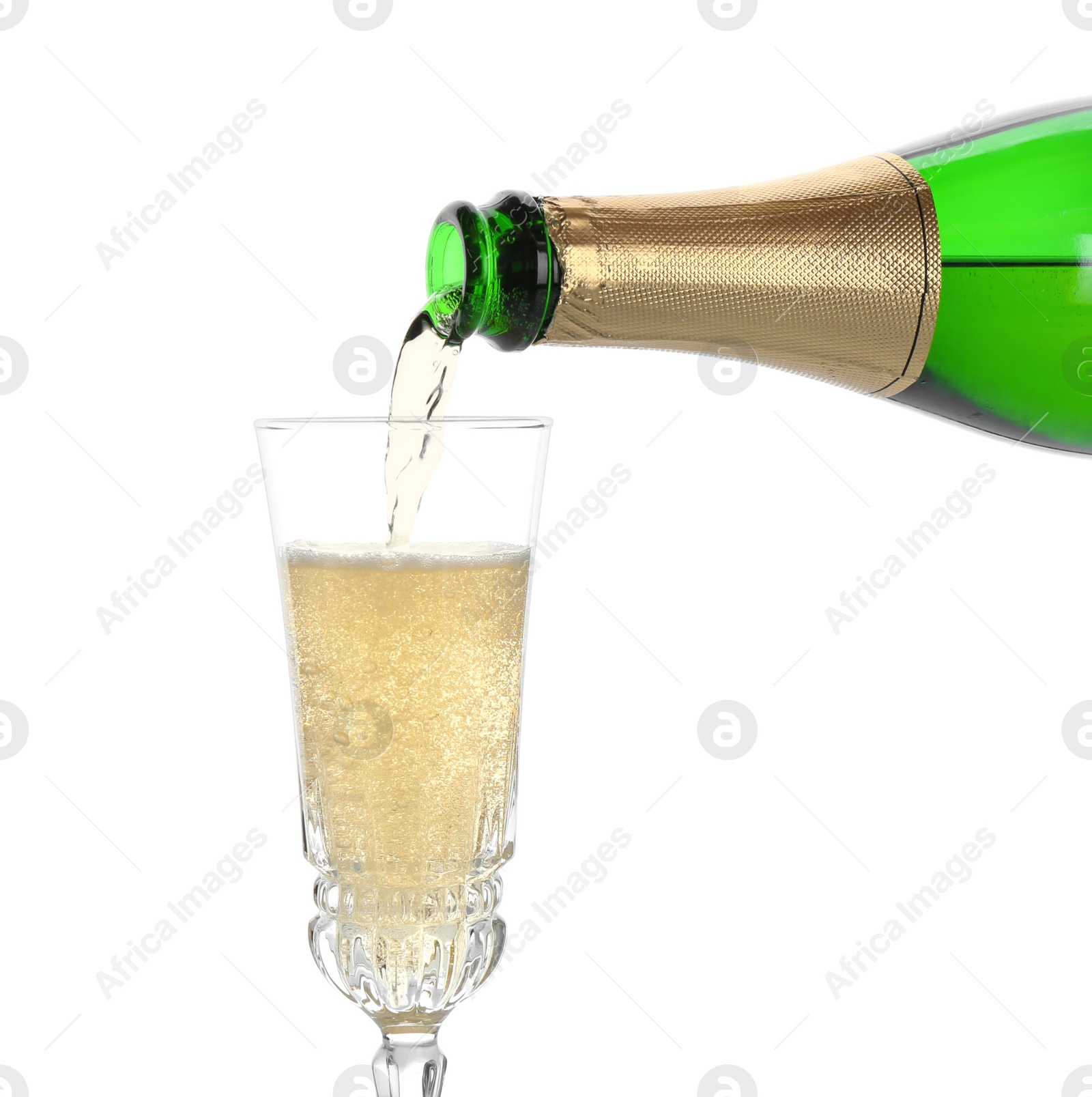 Photo of Pouring champagne from bottle into glass on white background. Festive drink