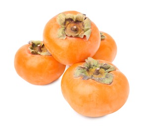 Photo of Whole delicious juicy persimmons on white background