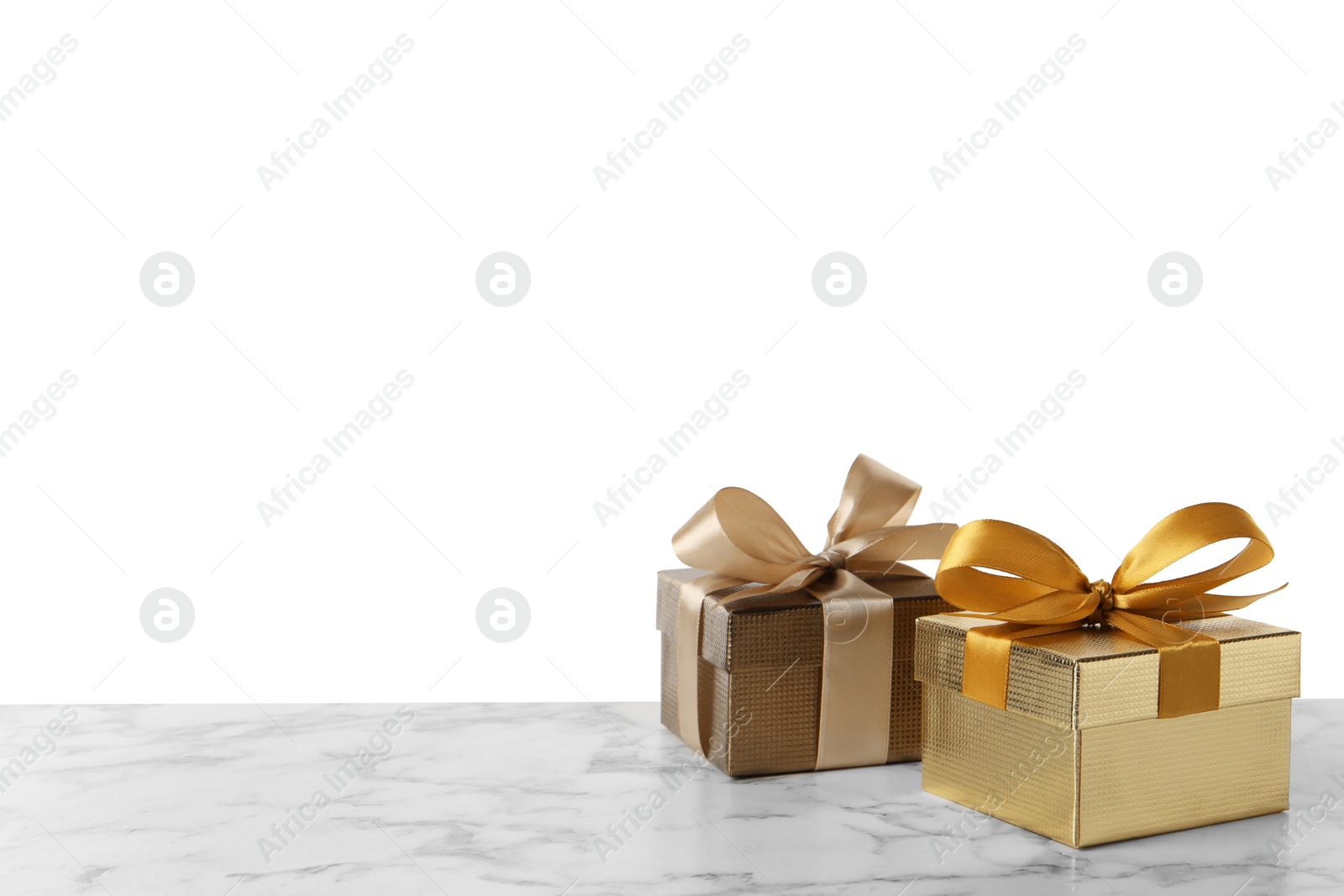 Photo of Two beautiful gift boxes on white marble table. Space for text