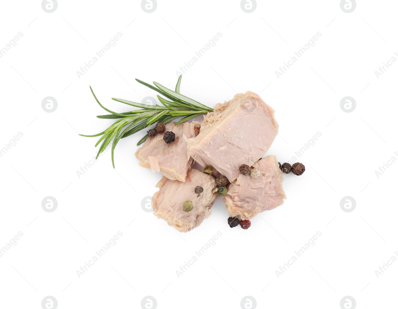 Photo of Delicious canned tuna chunks with rosemary and peppercorns isolated on white, top view