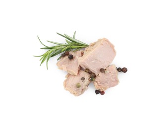 Photo of Delicious canned tuna chunks with rosemary and peppercorns isolated on white, top view