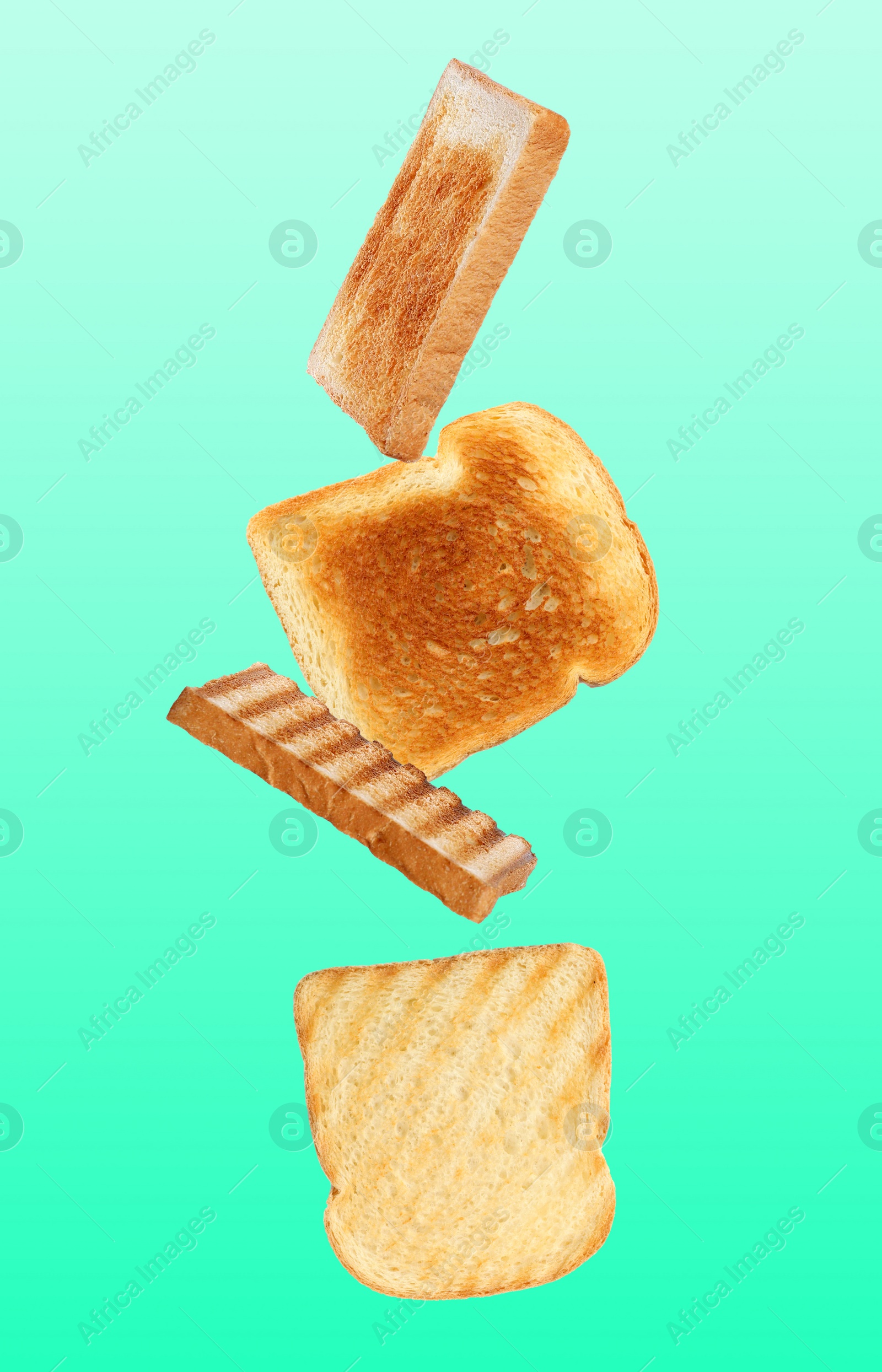 Image of Tasty toasts falling on color background 