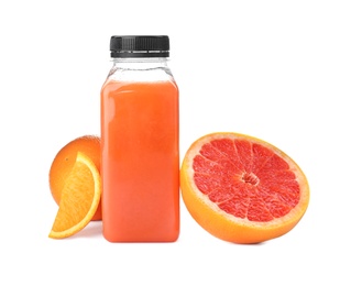 Photo of Bottle with healthy detox smoothie and citrus fruits on white background