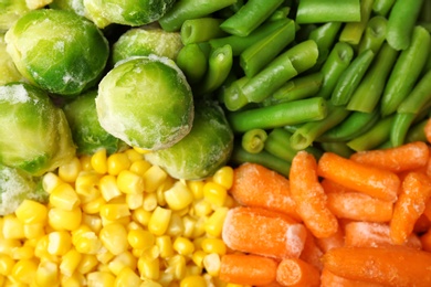 Mix of frozen vegetables as background, top view