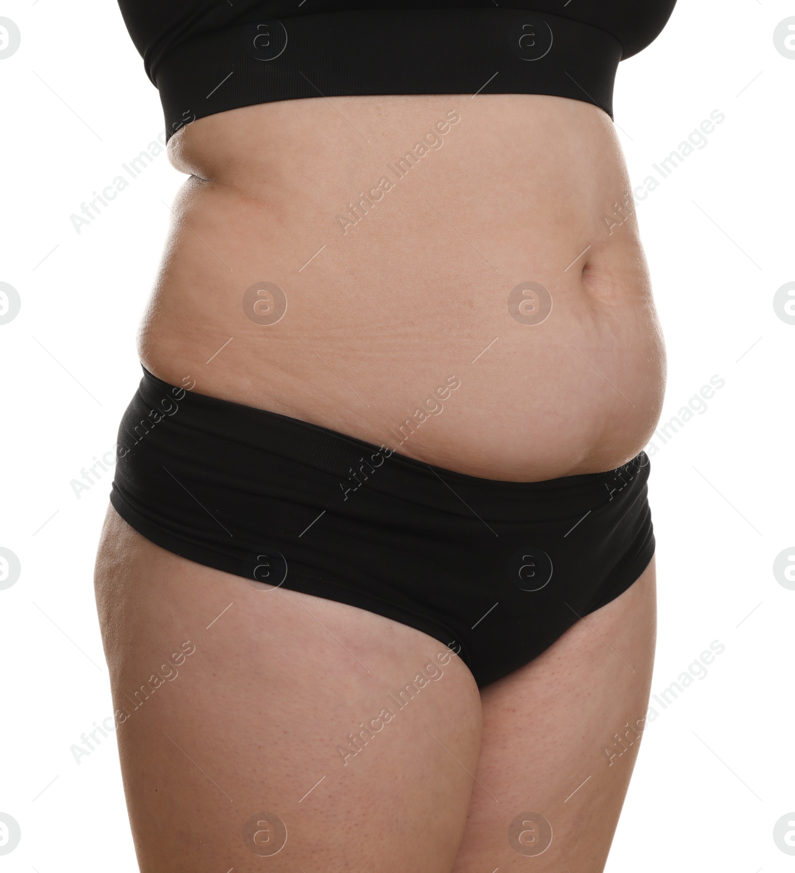 Photo of Woman with excessive belly fat on white background, closeup. Overweight problem