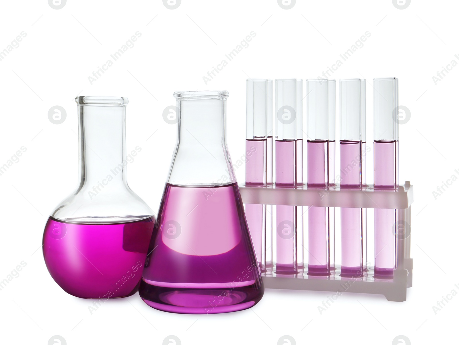 Photo of Laboratory glassware with purple liquid on white background