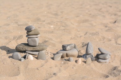 Photo of Different stones on sandy beach. Zen concept