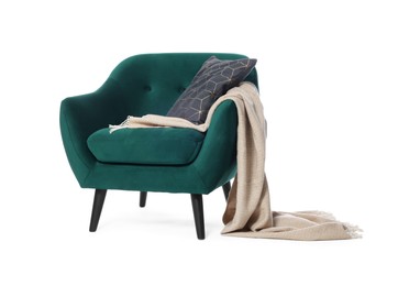 Photo of One green armchair with pillow and blanket isolated on white