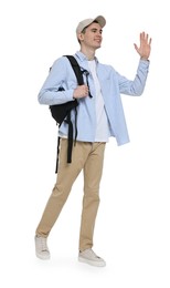 Photo of Young man with cap and backpack waving hand on white background