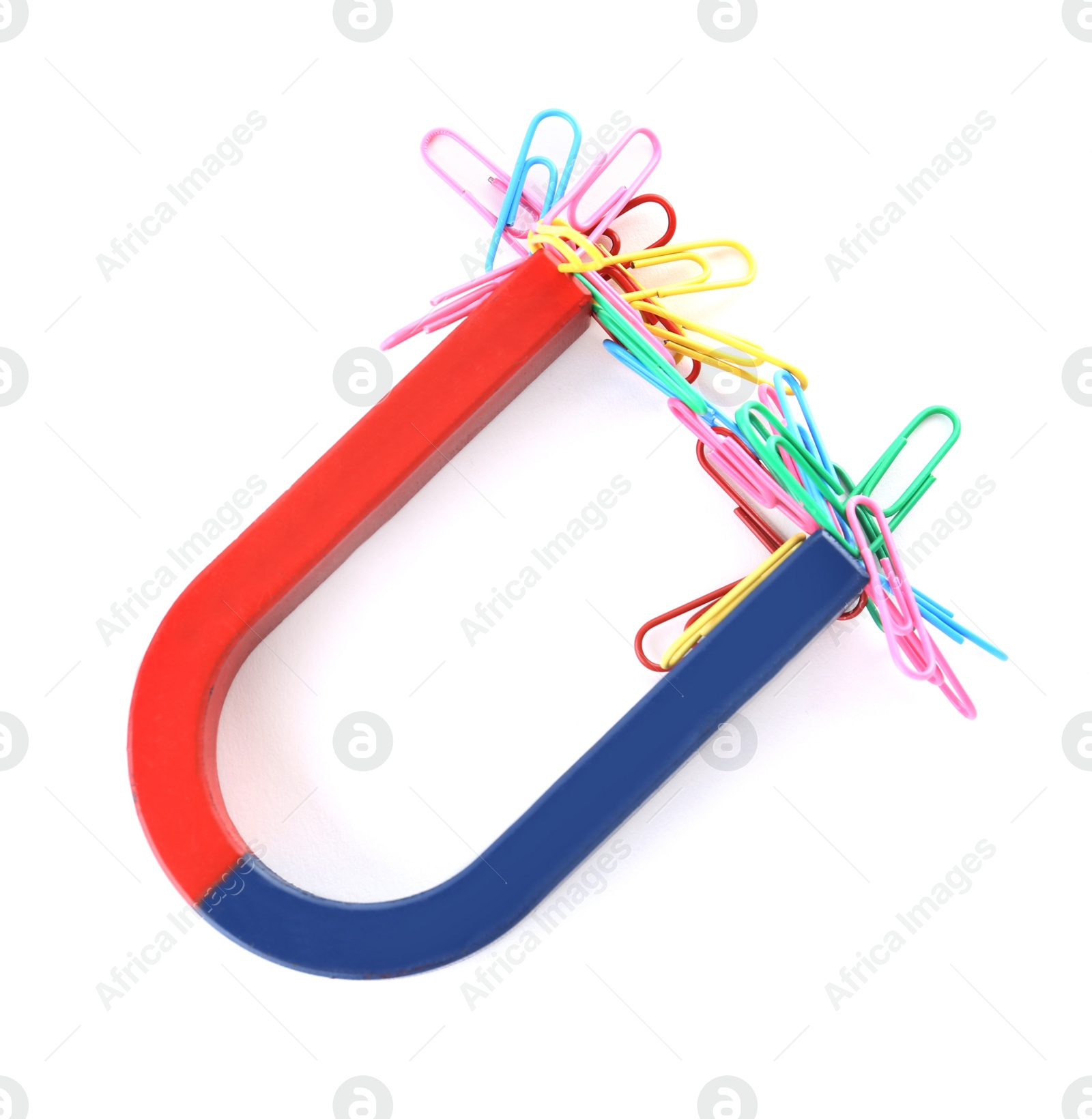 Photo of Magnet attracting paper clips on white background, top view