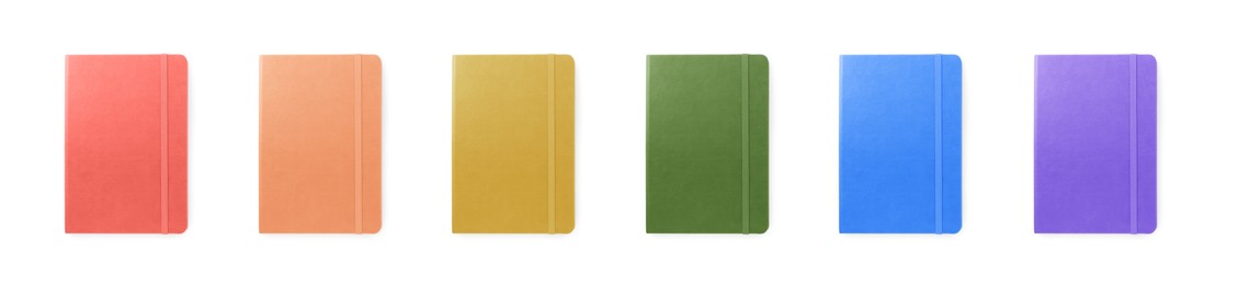 Image of Set with multicolor notebooks on white background, top view. Banner design