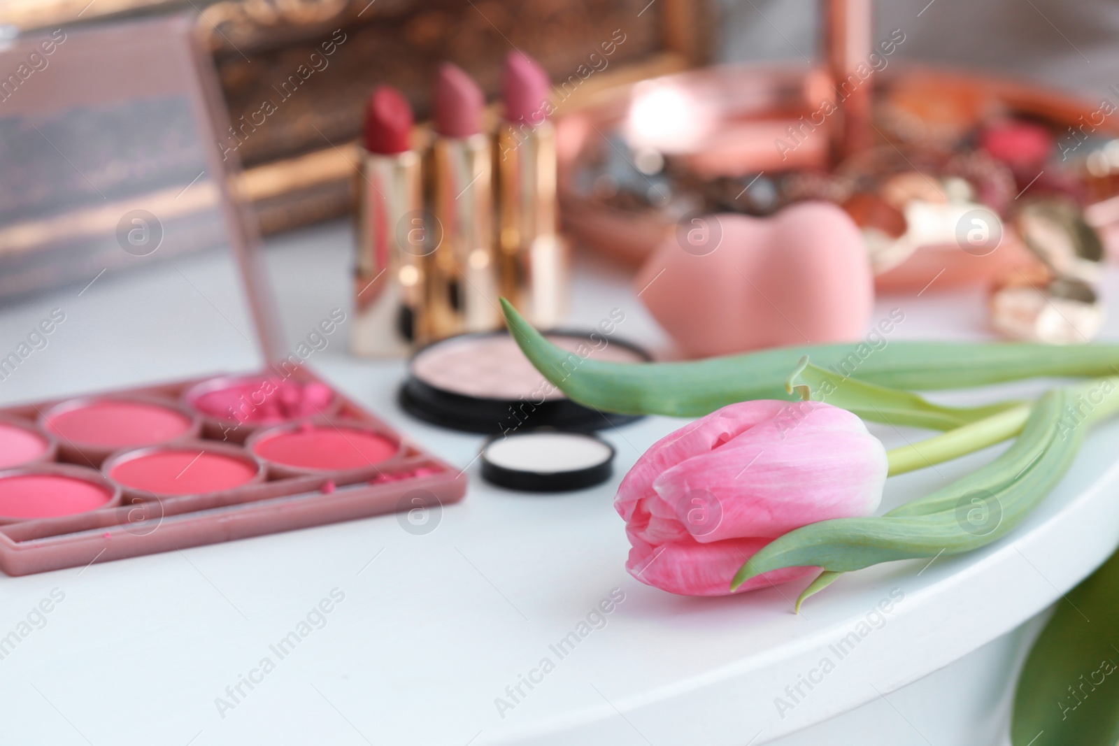 Photo of Beautiful tulip on dressing table in makeup room