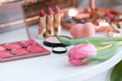 Photo of Beautiful tulip on dressing table in makeup room
