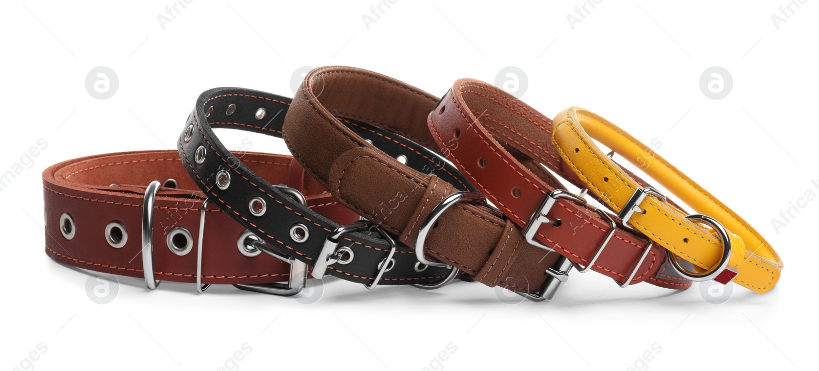 Photo of Different leather dog collars on white background