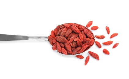 Photo of Spoon of tasty dried goji berries on white background, top view