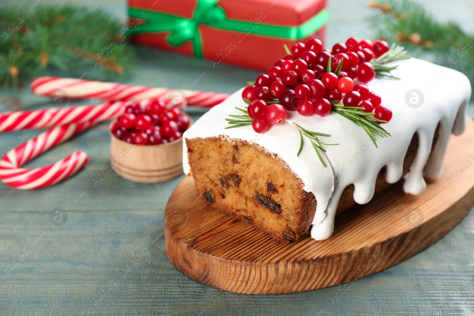 Photo of Traditional Christmas cake on light blue wooden table. Classic recipe