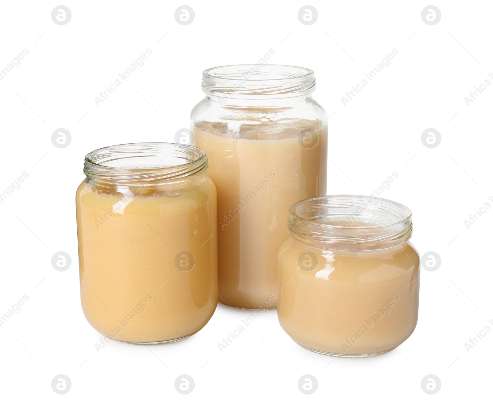 Photo of Baby food. Tasty healthy puree in jars isolated on white