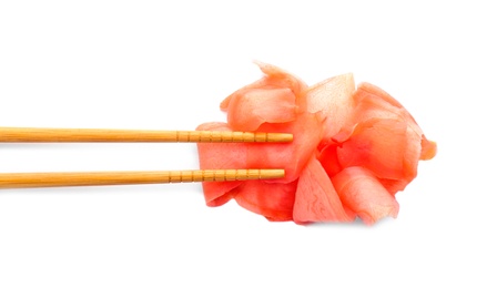 Photo of Chopsticks with pickled ginger on white background, top view