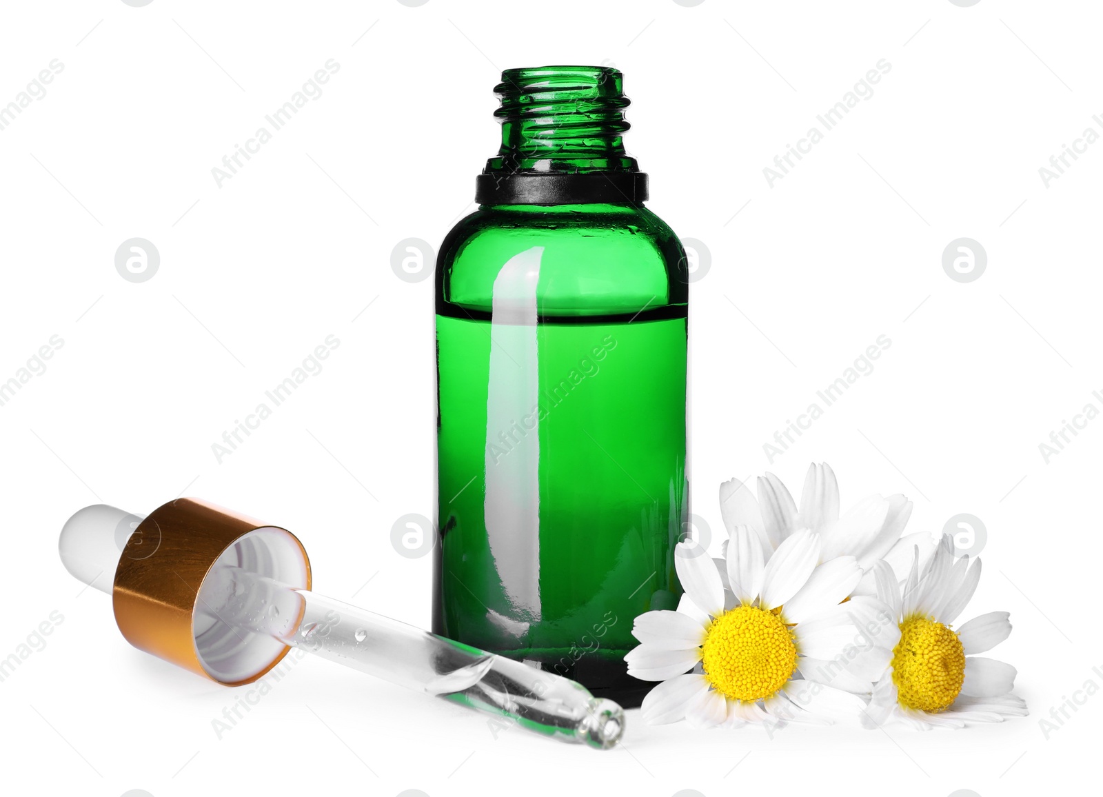 Photo of Bottle of chamomile essential oil, pipette and flowers isolated on white