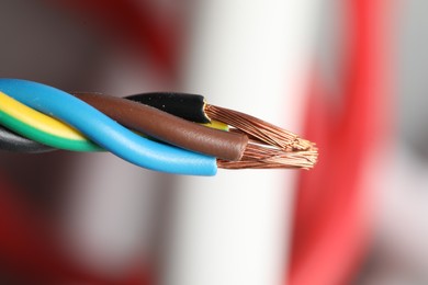 Colorful electrical wire on blurred background, closeup