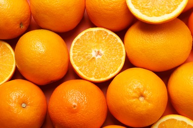 Photo of Tasty ripe fresh oranges as background, top view