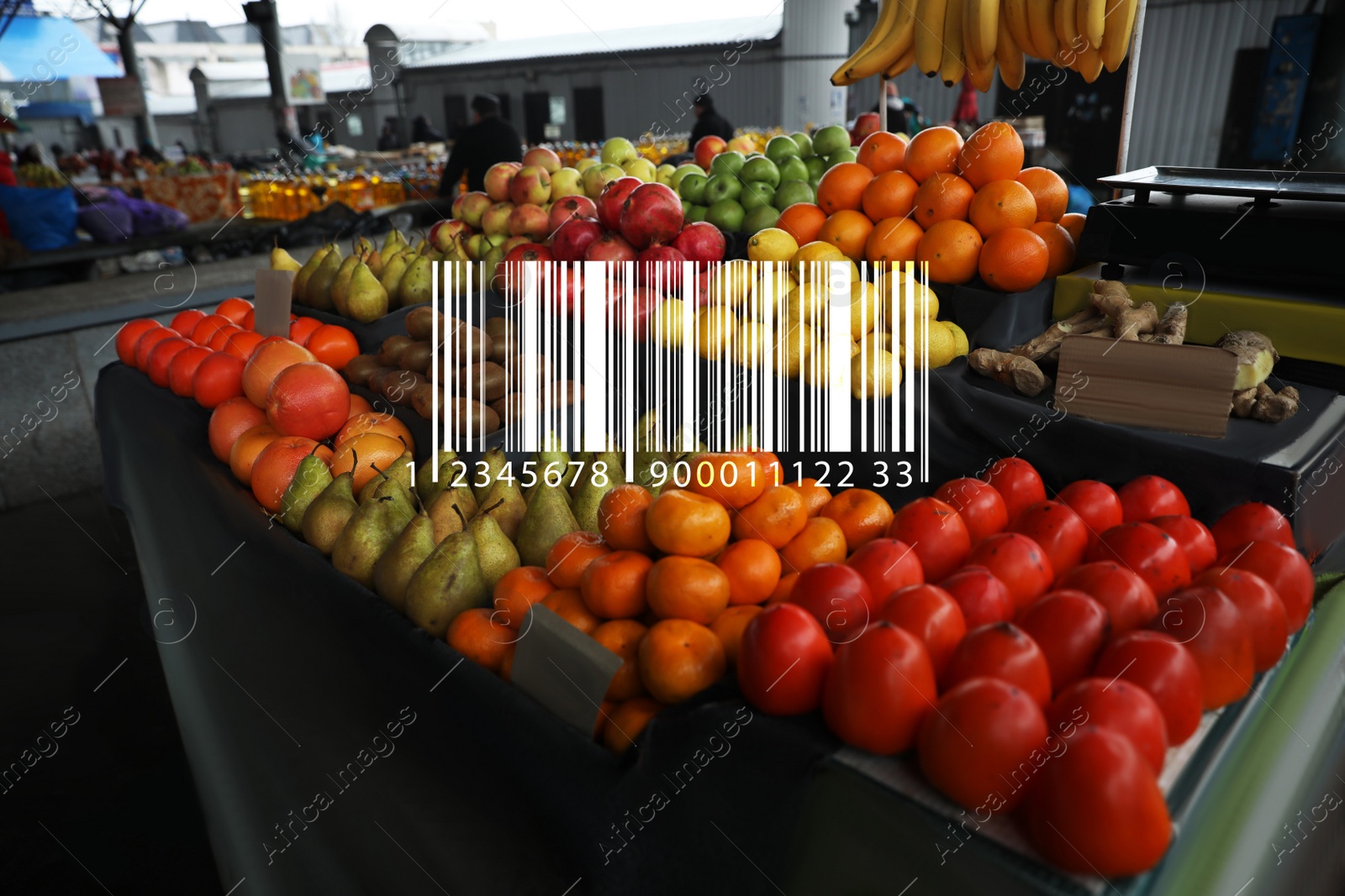 Image of Barcode and tasty fresh fruits on counter at wholesale market